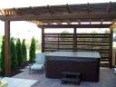 Patio Has Been Expanded and a Pergola and Screen Added